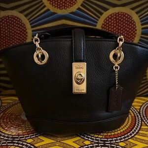 Coach Black and Gold Satchel with Structured Design